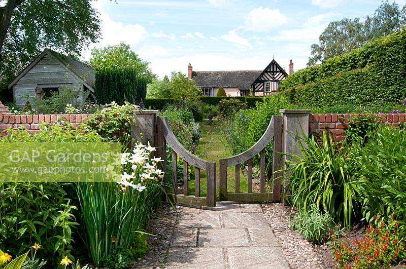 View through gate to The Sundial Garden to Wollerton Old Hall, Shropshire.