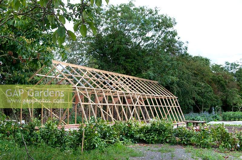 Building a greenhouse at Wollerton Old Hall Garden, Shropshire.