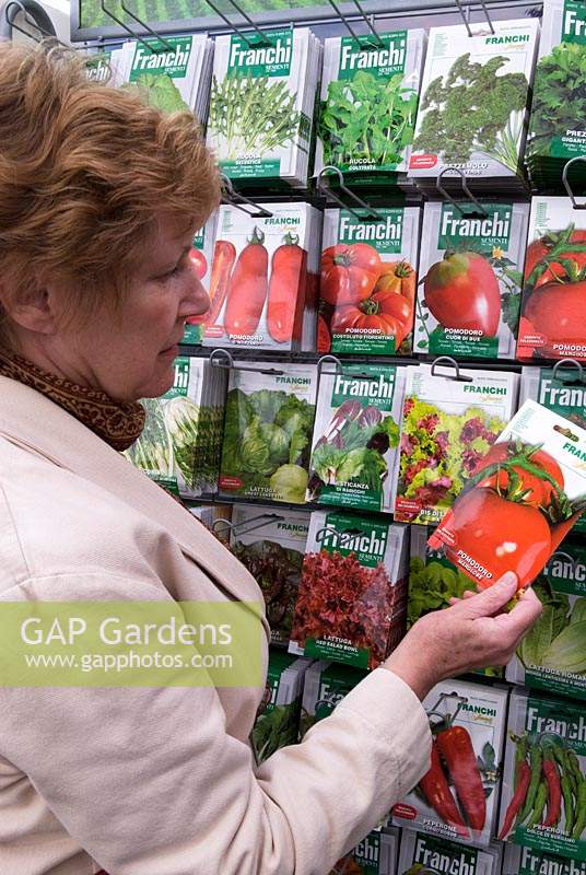 Woman shopping for salad seeds