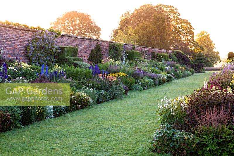 The 90-metre-long twin herbaceous borders. Arley Hall, Cheshire, UK.