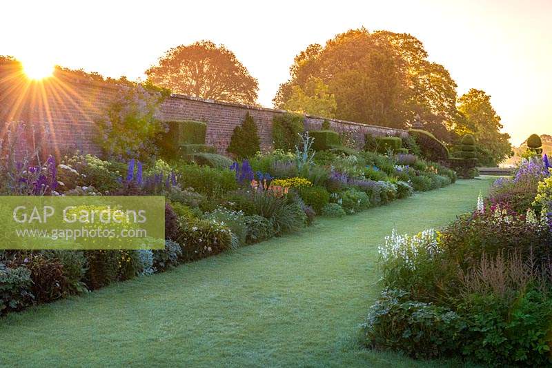 The 90-metre-long twin herbaceous borders at Arley Hall.  Seen at sunrise.