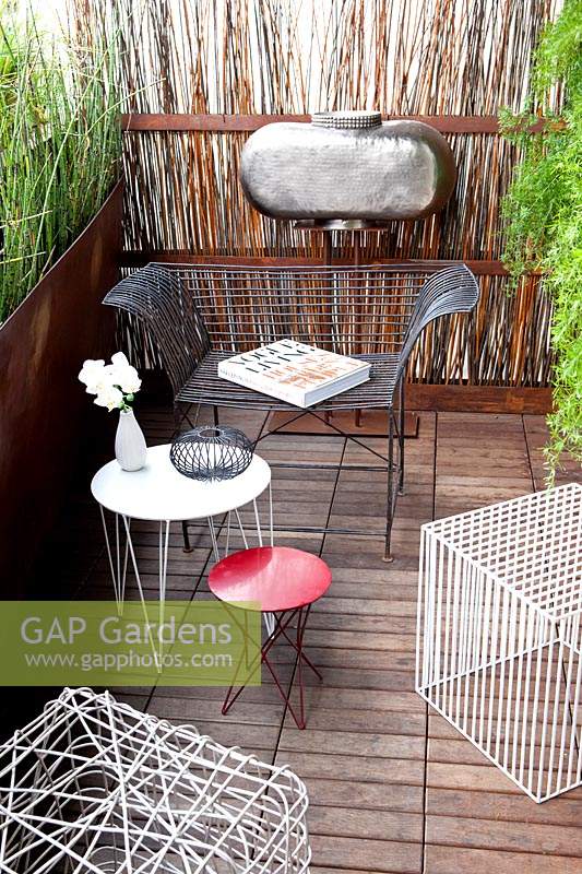 Small terrace garden with modern furniture designed by Antonino Sciortino.
