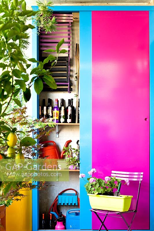 Colourful tool cabinet on modern terrace 