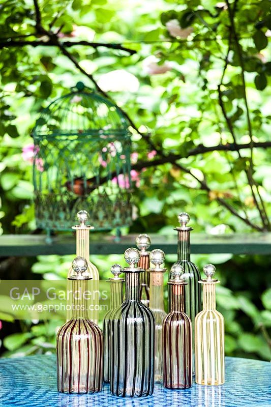 Murano glass bottles from 1970 displayed in table. 