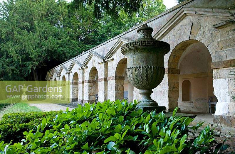 Classical urn, behind a view along The Praeneste Terrace with its series of seven stone arches