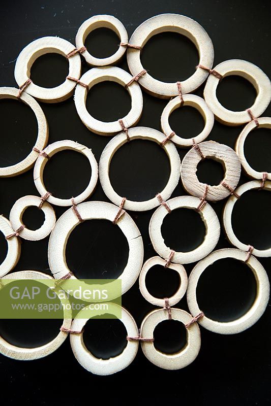 Bamboo table mat, cut circles of bamboo canes tied together 