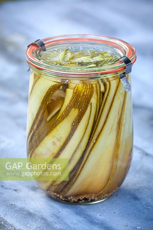 Pickled courgettes in kiln jar