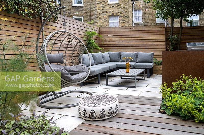 Modern Small Outdoor Room  with decking and a seating area with a sofa
