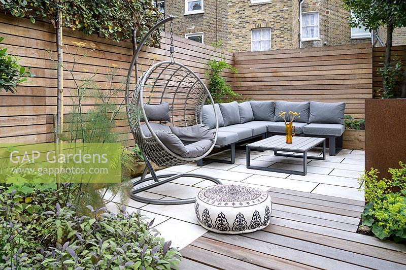 Modern Small Outdoor Room  with decking, seating area with a sofa and hanging chair