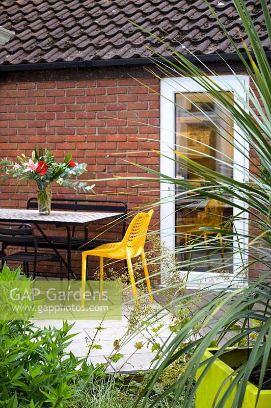 Small Modern Garden with metal chairs and table