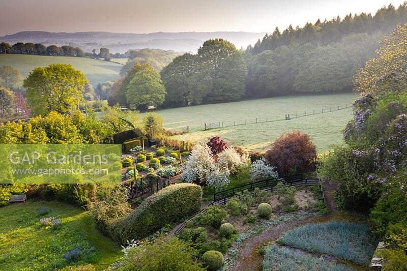 View over the Vegetable Garden to to the surrounding countryside. Veddw House Garden, Monmouthshire, Wales, UK. 