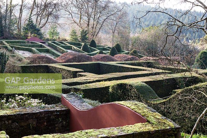 View over the Ruin to the Grasses Parterre in formal country garden, April