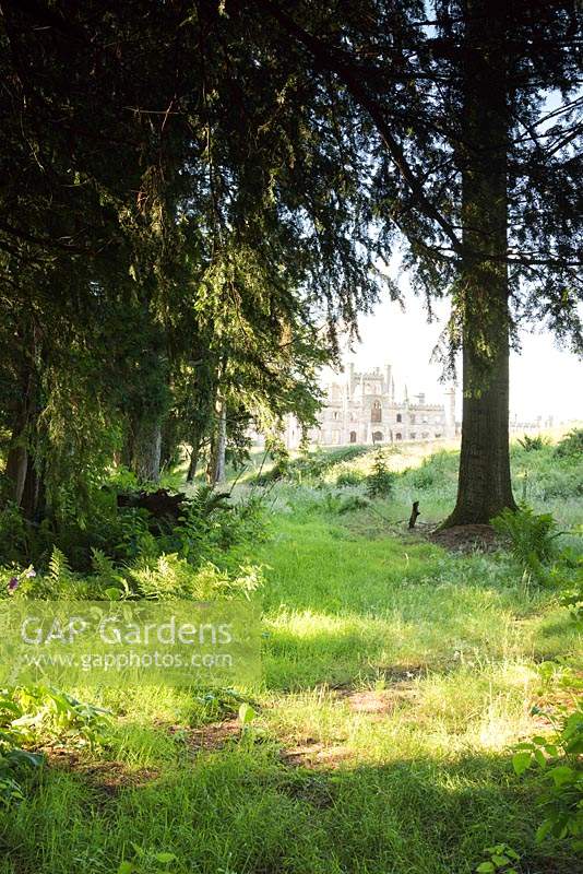 Lowther Castle, Penrith, seen from inside a wooded area of the garden
