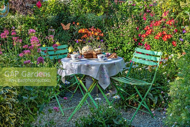 Garden table with tea for two at Driftwood in Sussex