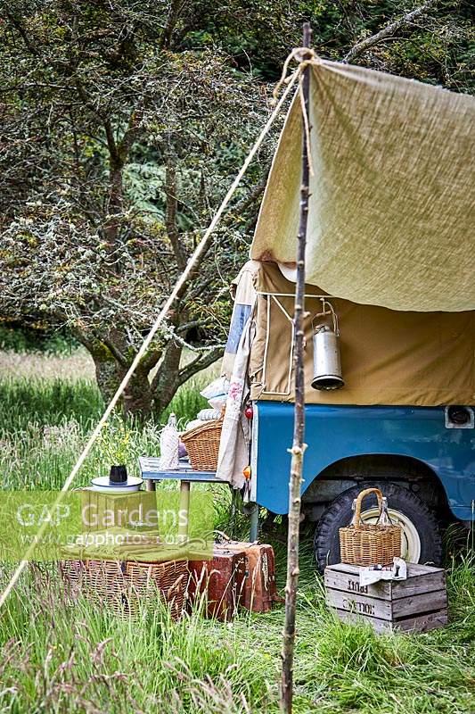 Landrover with awning and picnic setting