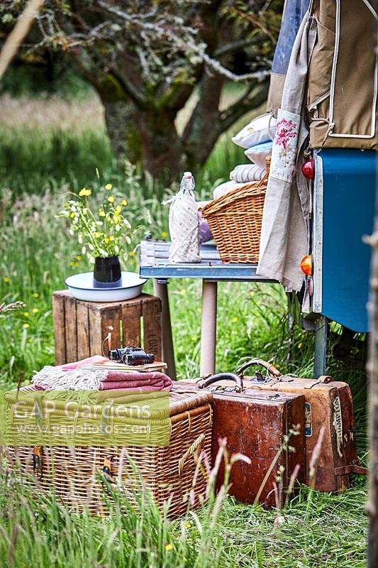 Picnic baskets and vintage luggage at the back of landrover