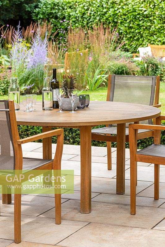 Dining furniture on patio with view to garden