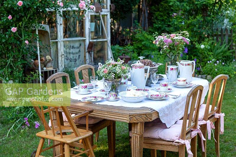 Outdoor table laid for afternoon tea