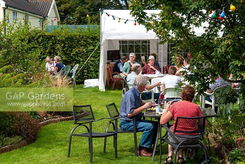 Visitors enjoying tea and refreshments at an Open Garden event. 