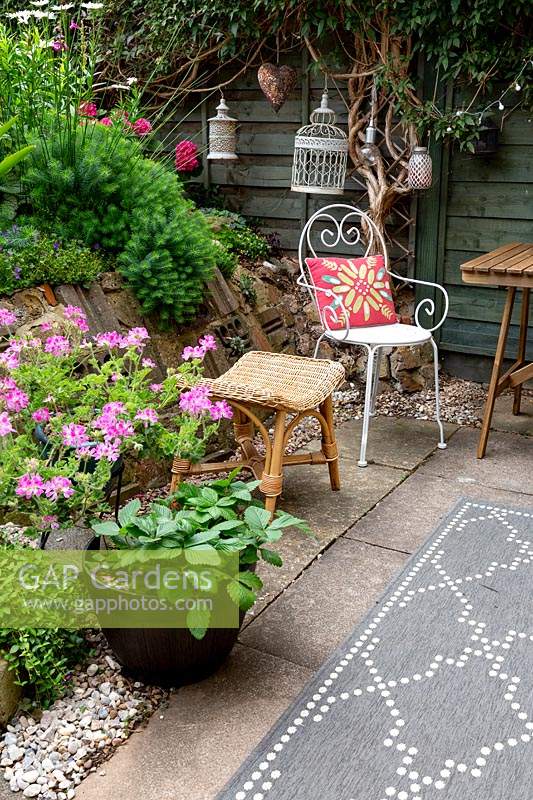 Patio with seating and summer bedding in containers