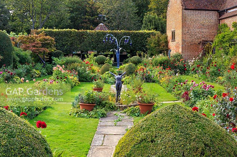 View of Dahlia beds and Buxus - Box - topiary with classical and contemporary sculptures