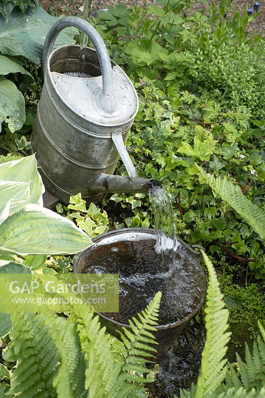 Water feature using watering can and bucket