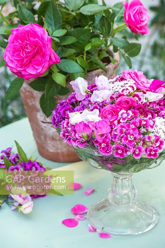 Dianthus barbartus - Sweet williams, roses and sweet peas in vintage glass vase