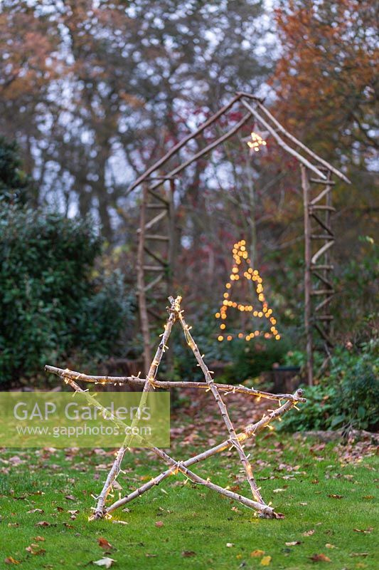 Illuminated natural star with fairylights made with lengths of hazels sticks