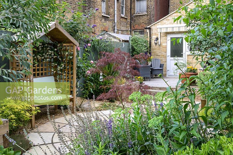 Gazebo and seat in East London Town Garden by Earth Designs. 