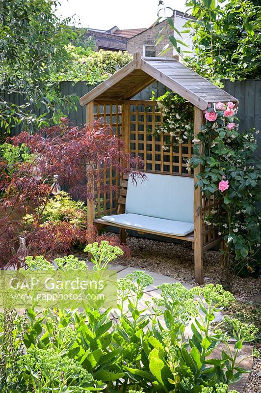 Gazebo and seat in East London Town Garden by Earth Designs.
