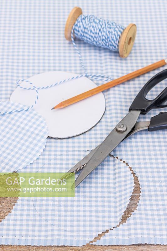 Gingham check fabric for decorating glass jar lids. 