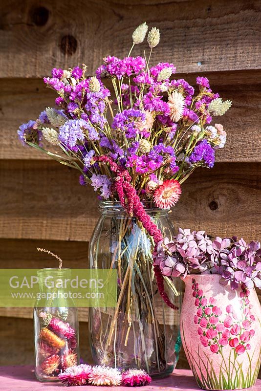 Dried flower arrangement in glass jar with Statice, Grasses, Amaranthus and everlasting flowers