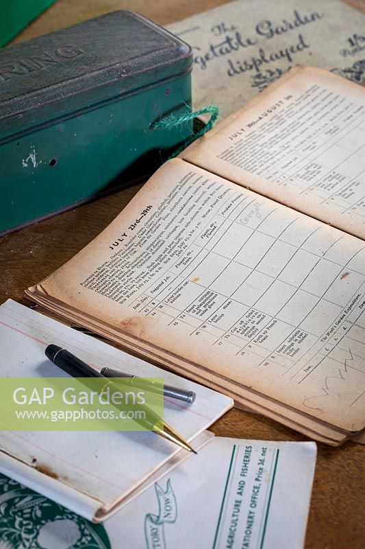 Gardening literature, advice, seed catalogues and notes in vintage potting shed