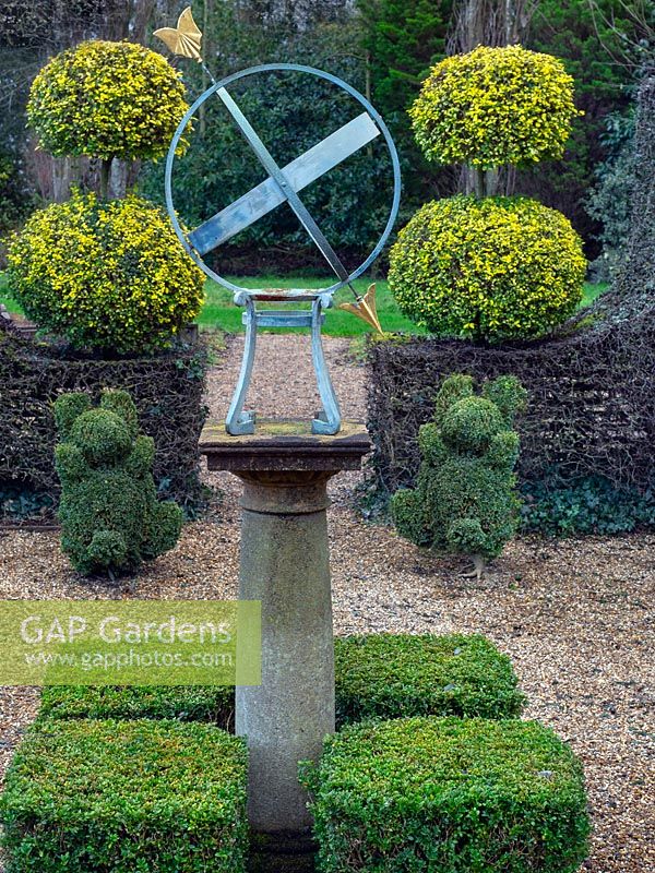 Armillary sun dial with clipped Buxus - Box - hedging and topiary