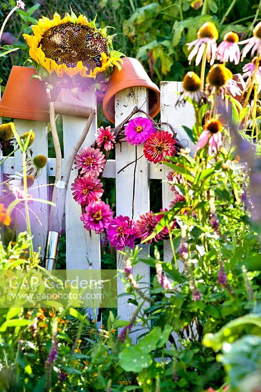 Wreath with Zinnia flowers hanging on the gate.