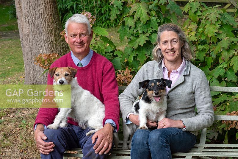 Rupert and Sarah Eley, in East Bergholt Gardens with their two Yorkshire terriers, Puffball and Flopsy.
