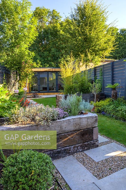 Walthamstow Modern Garden  with Raised Bed and Garden Room by Earth Designs 