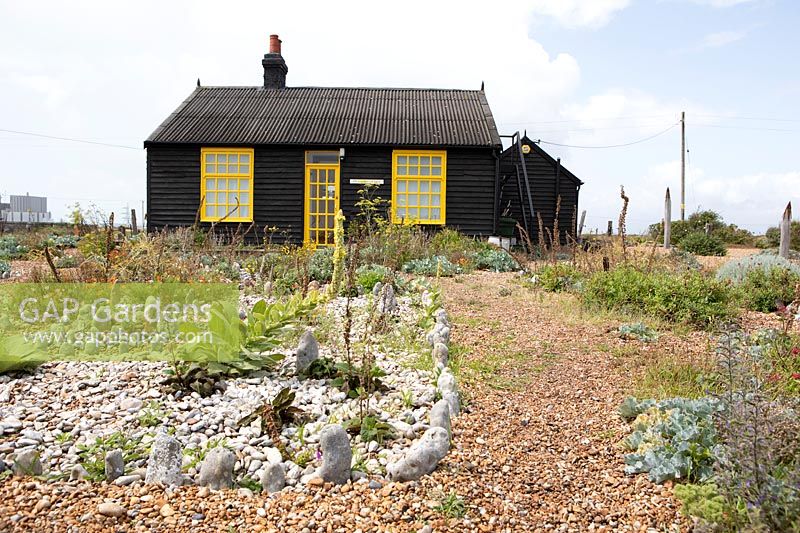 Cottage and garden on a shingle beach bed of white stones