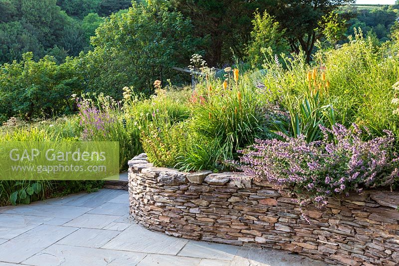 Drystone raised bed filled with mixed planting