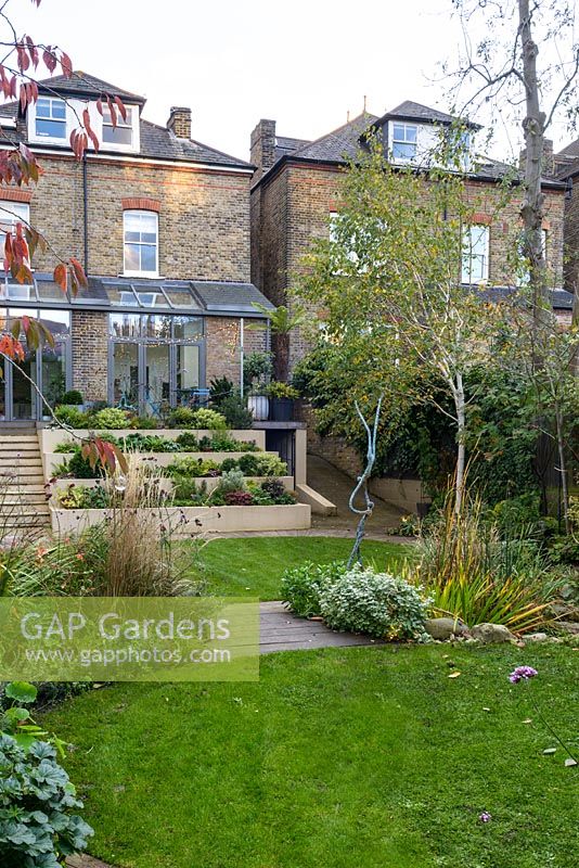 Low maintenance  city garden - stepped beds and stairs