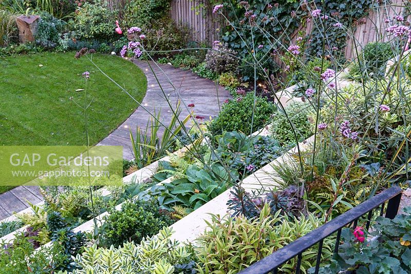 Low maintenance city garden with stepped raised beds