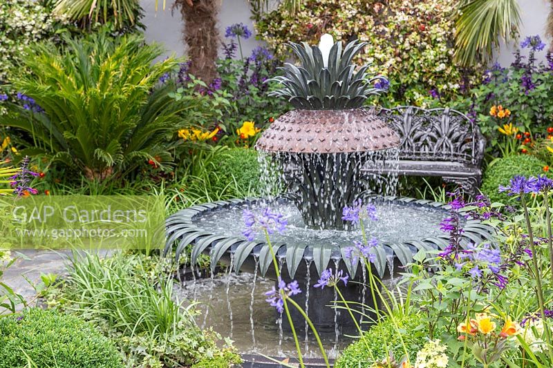 Decorative water fountain in  Great Gardens of the USA, The Charleston Garden, RHS Hampton Court Palace Flower Show, 2017 Design: Sadie May Studios Ltd.

