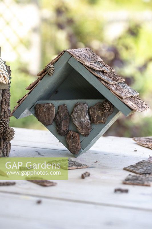 Bird house on a wooden surface