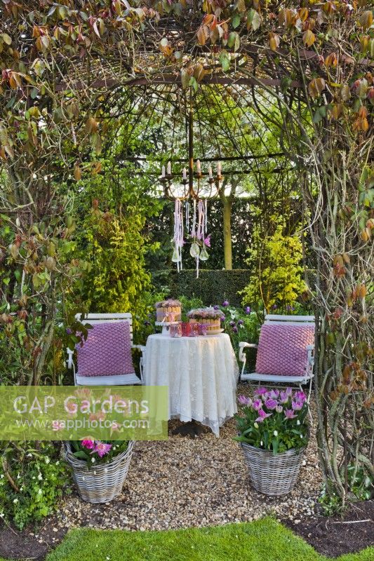 Gazebo with seating area in spring.