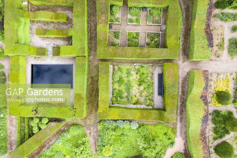 View taken by drone of clipped hedges of yew forming garden rooms. July. Summer