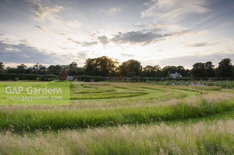 Grass maze with spiral mound at its centre at Gordon Castle Walled Garden, Scotland in July. Design by Arne Maynard.
