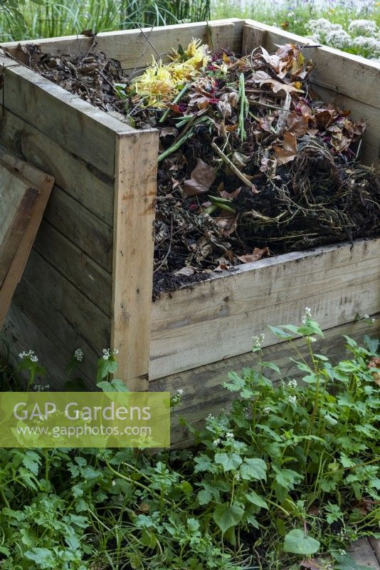 The RHS COP26 Garden, has a wooden compost bin, which is easy to make out of pallets or planks of wood.
