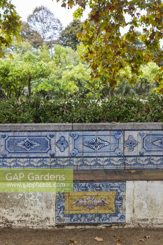 Stone bench faced with blue glazed tiles -called Azulejos. Seixal, near Setubal, Portugal. September