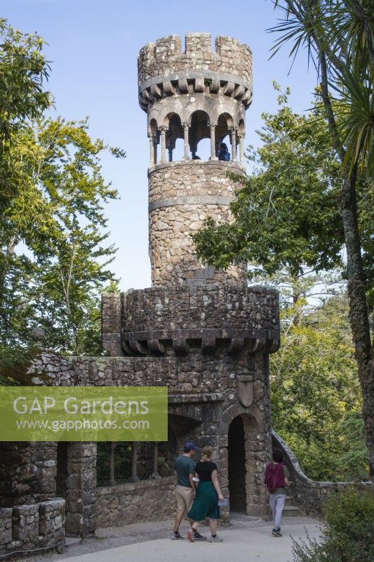 The Regaleira tower with visitors. Stone circular tower with arched openings. Sintra, near Lisbon, Portugal, September