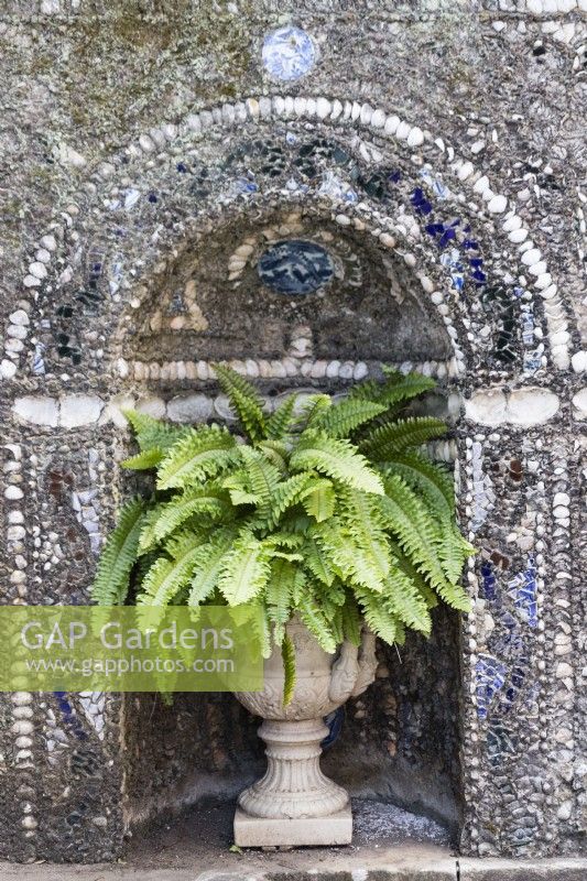 Highly decorated wall at back of a raised pool in the Garden of Venus. Wall is faced with mosaics and contains niche with urn containing ferns. Lisbon, Portugal, September.